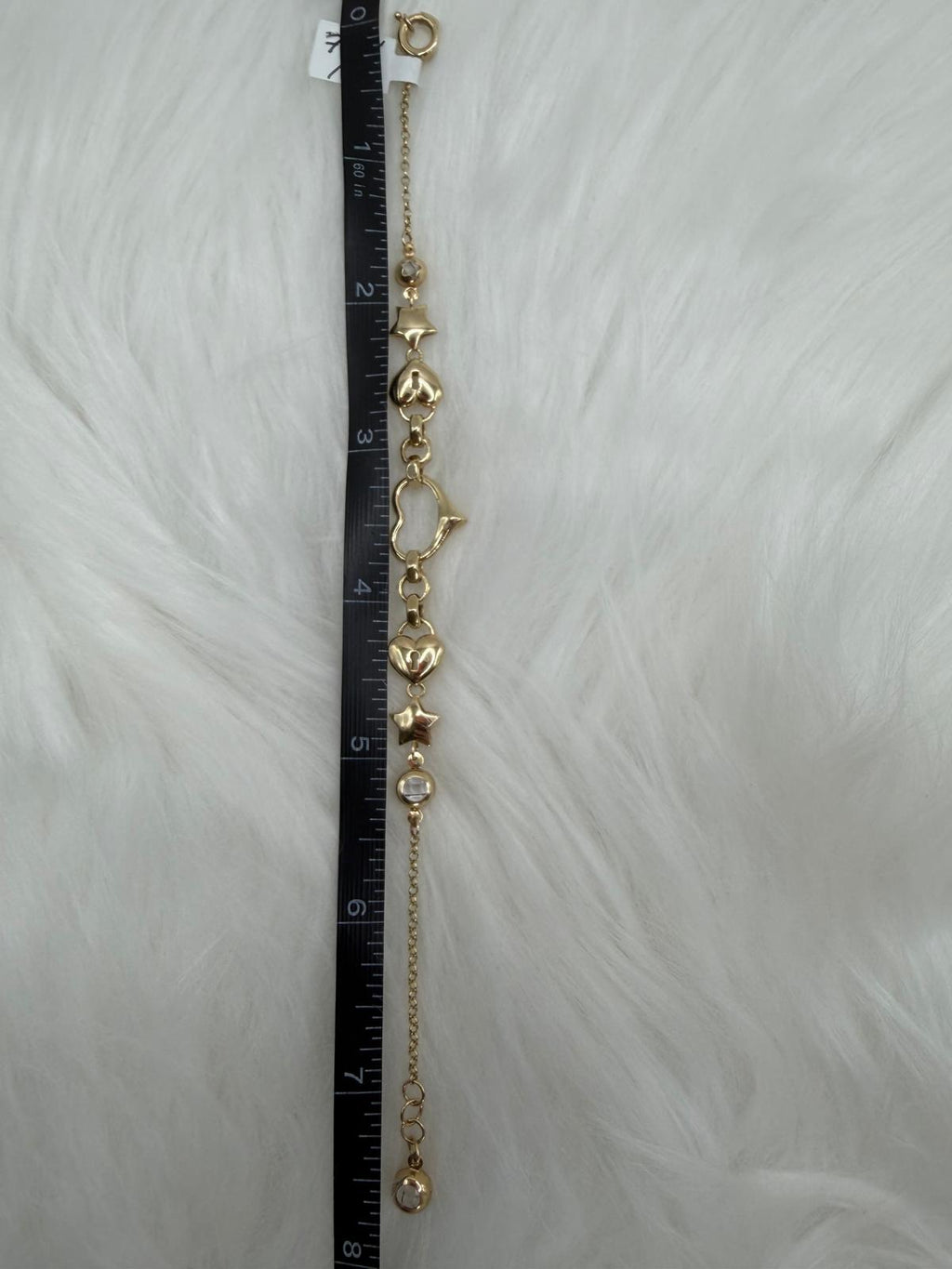 BRAZALETE EN ORO 10K CON CORAZON ESQUELETICO